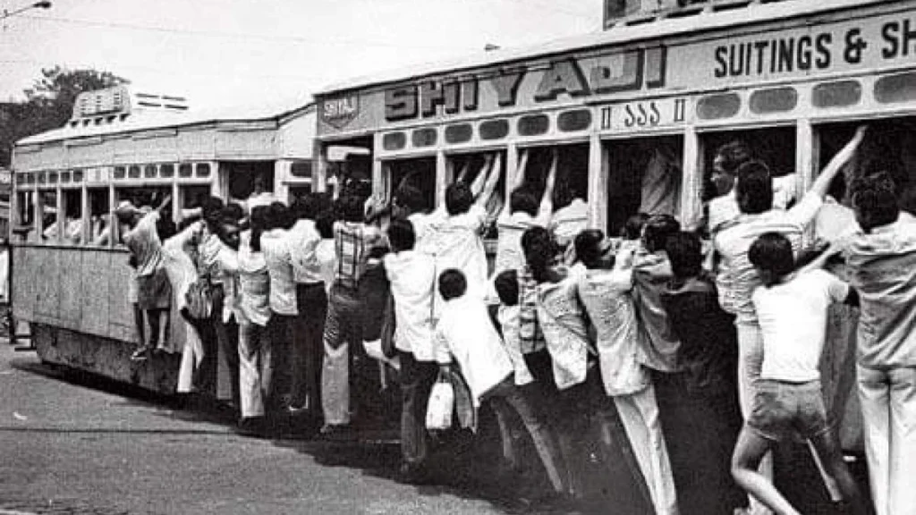 tram fare movement 1953 kolkata protest people hanging on tram during agitation