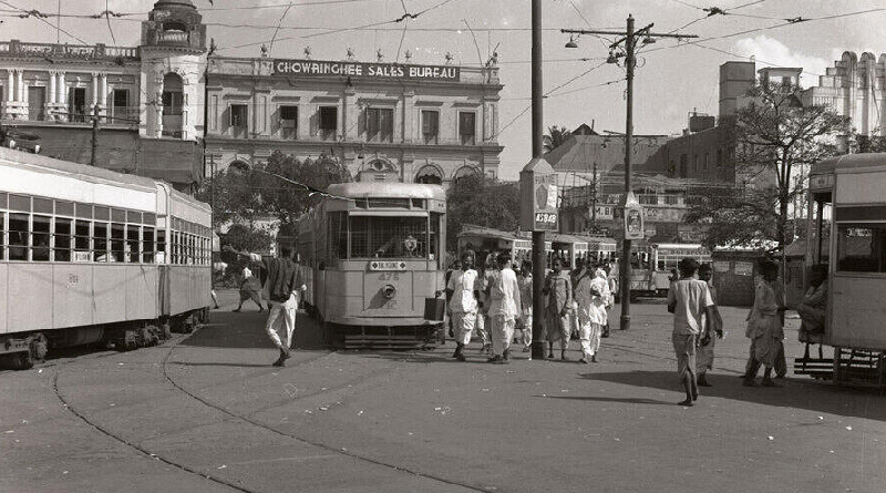 kolkata tram scene 1953 chowringhee area during tram fare movement people walking near tram lines